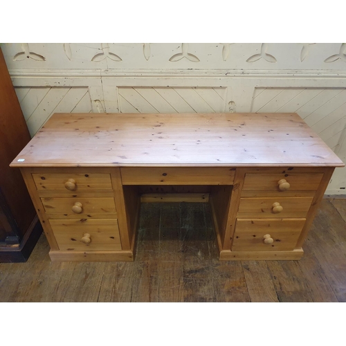 981 - A pine kneehole desk, 170 cm wide