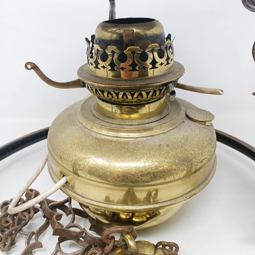 818 - An early 20th century wall ceiling oil lamp, with an opaque glass shade, and a pair of silver plated... 