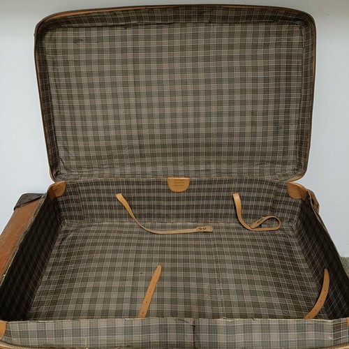 825 - A brown leather trunk, 91 cm wide, and three other cases (4)