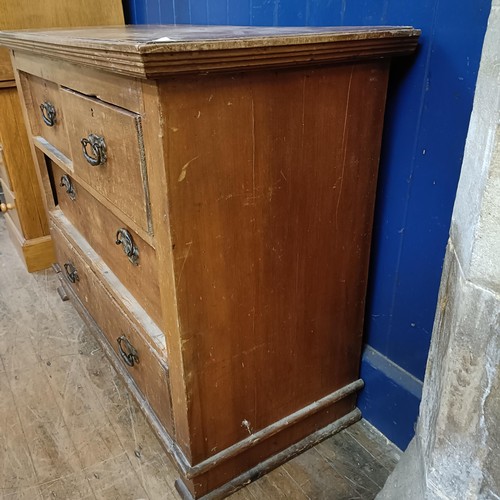 935 - A pine chest, having two short and two long drawers, 101 cm wide