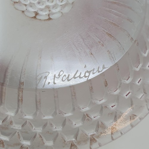 10A - A Lalique pin dish, the base inscribed R Lalique France, 10 cm diameter, a paperweight, and a scent ... 