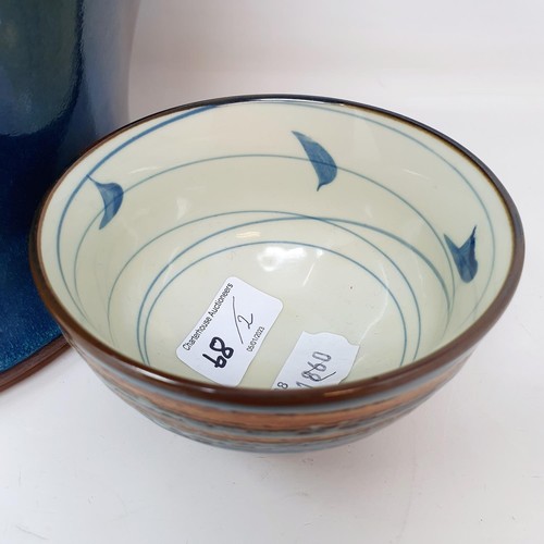 68 - A 20th century blue glazed vase, 32 cm high, and a Studio pottery bowl, 8 cm high (2)