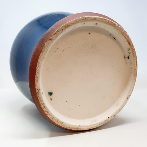 68 - A 20th century blue glazed vase, 32 cm high, and a Studio pottery bowl, 8 cm high (2)