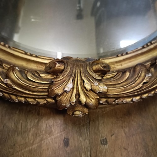 913 - An early 20th century gilt gesso oval wall mirror, 100 x 70 cm