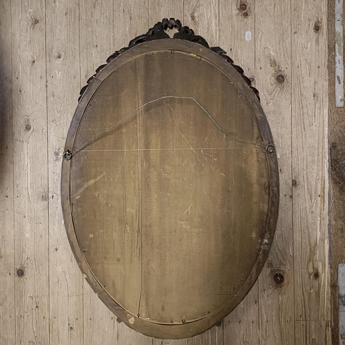 913 - An early 20th century gilt gesso oval wall mirror, 100 x 70 cm