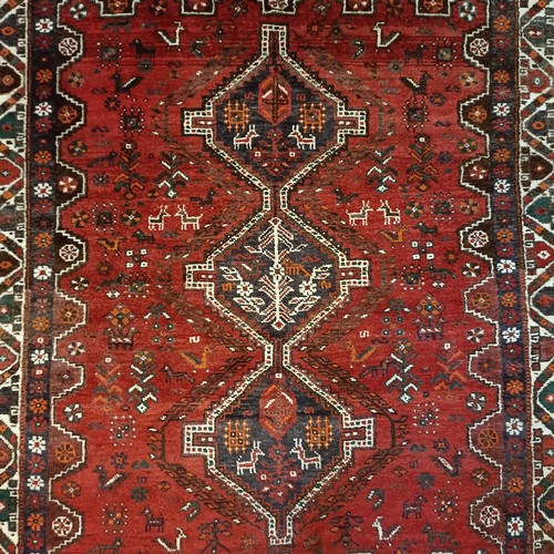 982 - A red ground carpet, 197 x 168 cm