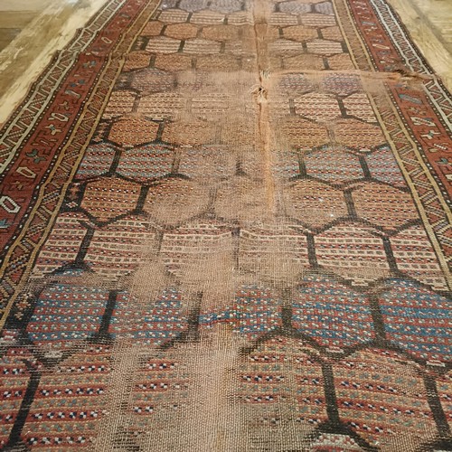 984 - A Persian red ground runner, 253 x 196 cm