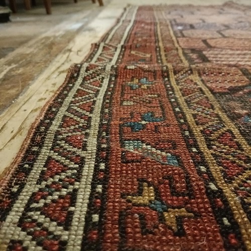 984 - A Persian red ground runner, 253 x 196 cm