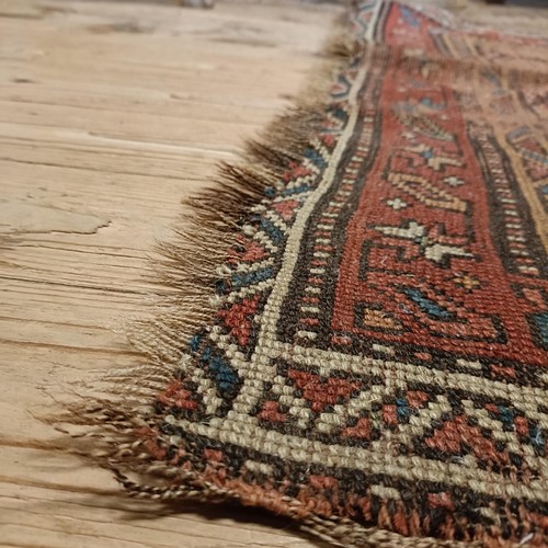 984 - A Persian red ground runner, 253 x 196 cm