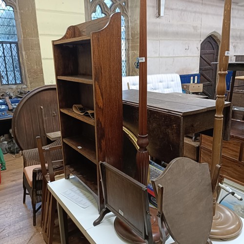 977 - An oak drop leaf table, 99 cm wide, an oval mirror, a set of four oak dining chairs, and other items... 