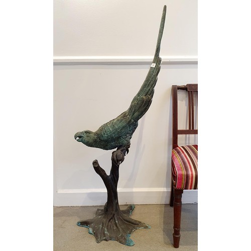 131 - A bronze figure, of a parrot perched on a branch, 134 cm high