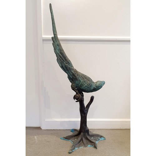 131 - A bronze figure, of a parrot perched on a branch, 134 cm high