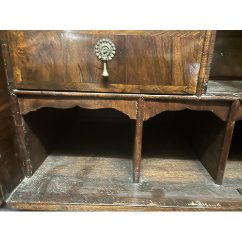 871 - An 18th century walnut cabinet on chest, the top with a drawer above two cupboard doors to reveal a ... 