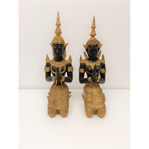 506 - A pair of painted metal figures of goddesses, 33 cm high