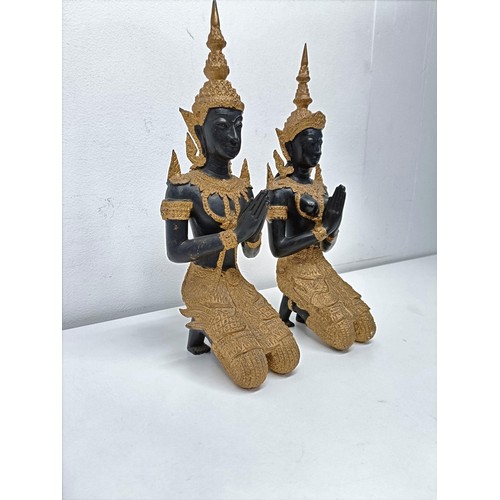 506 - A pair of painted metal figures of goddesses, 33 cm high