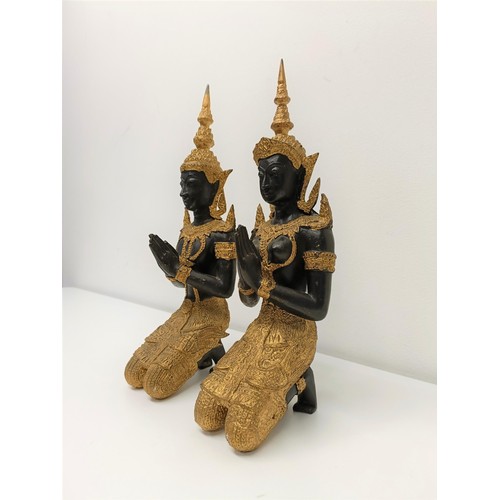 506 - A pair of painted metal figures of goddesses, 33 cm high