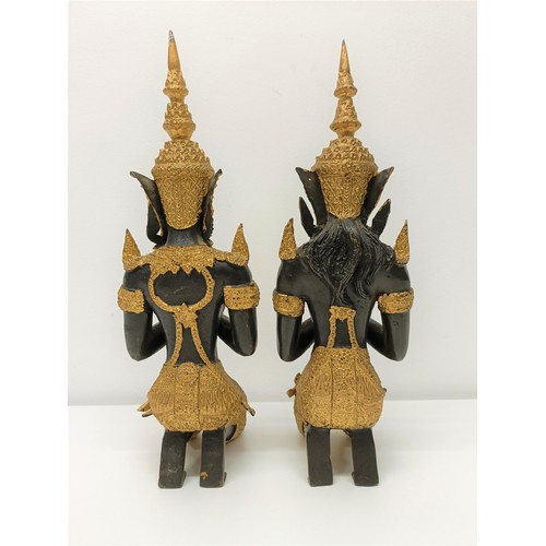 506 - A pair of painted metal figures of goddesses, 33 cm high