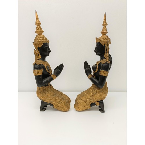 506 - A pair of painted metal figures of goddesses, 33 cm high