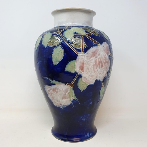 546 - A Royal Doulton vase, decorated roses, 31 cm high