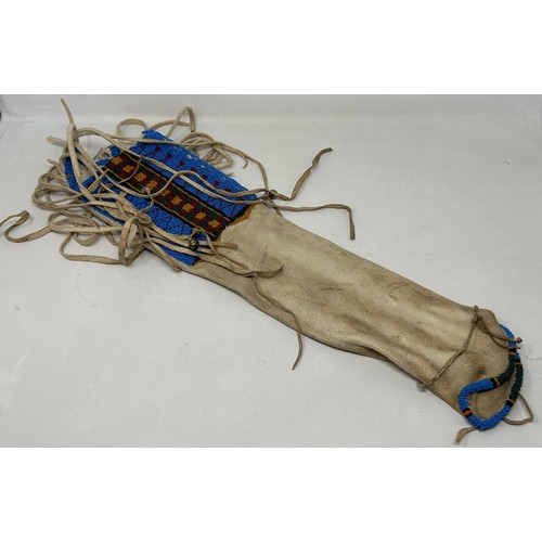 555 - A Native American Indian beaded pipe bag, 104 cm (over tassels)