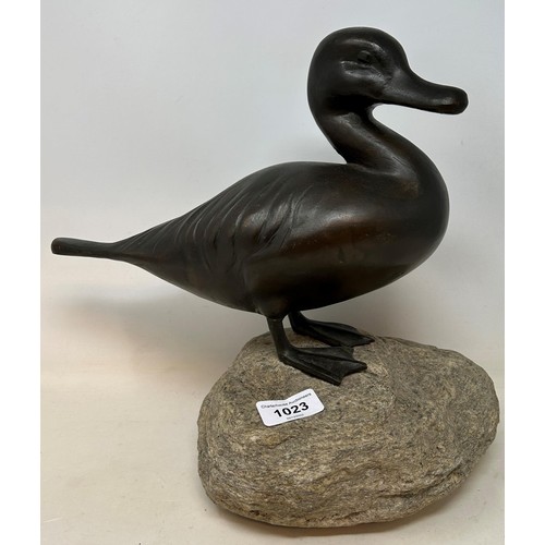 510 - A bronze duck, on a hardstone plinth, 34 cm high