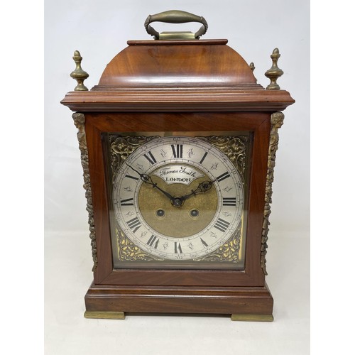 552 - An 18th century style bracket clock, the arched brass dial signed Thomas Smith, London, with a silve... 