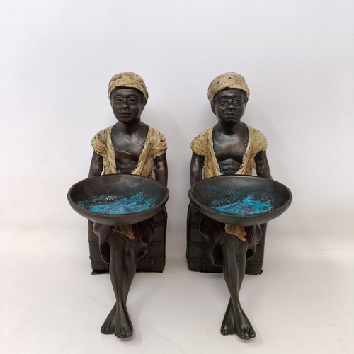 541 - A pair of cold painted bronze salts, in the form of eastern boys, 20 cm high (2)