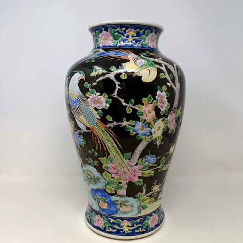 544 - A Chinese vase, decorated blossom, 38 cm high