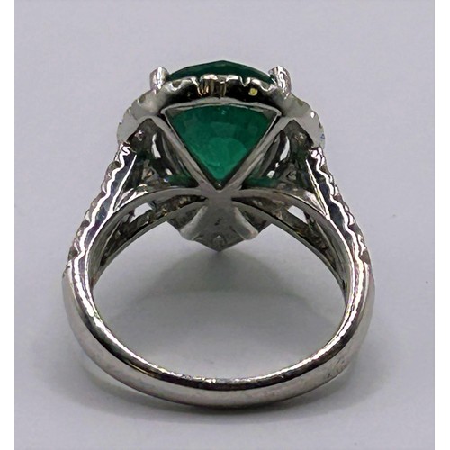 4 - An 18ct white gold, emerald and diamond ring, ring size H...