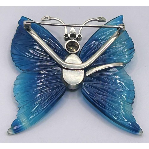 8 - A white gold and diamond butterfly brooch, with carved blue stone wings, 5 cm wide...