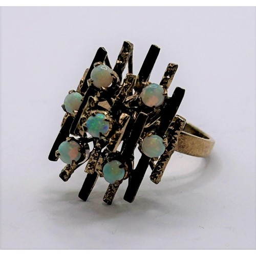 10 - A 9ct gold and opal abstract ring, ring size Q...