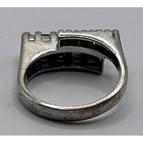 35 - A silver coloured metal, sapphire and diamond ring, ring size L...