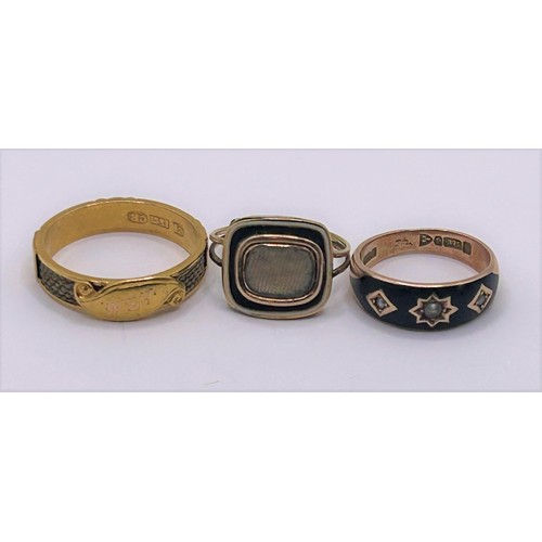 52 - A gold blue and white enamel memorial ring, ring size L, and two others (3)...