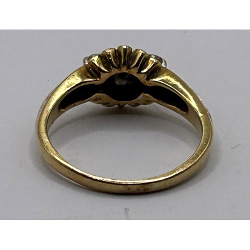 54 - A yellow coloured metal and diamond ring, ring size L...