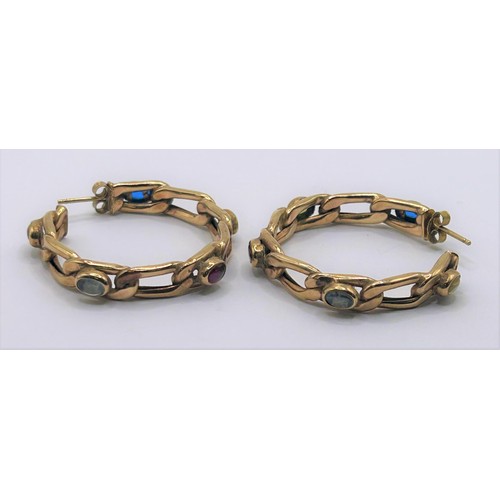 55 - A pair of yellow metal and multicoloured stone hoop earrings...