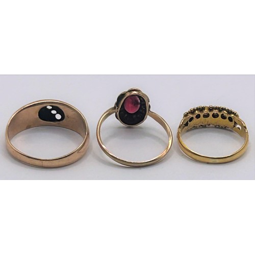 61 - A 9ct gold and garnet ring, ring size H, and two other rings (3)...