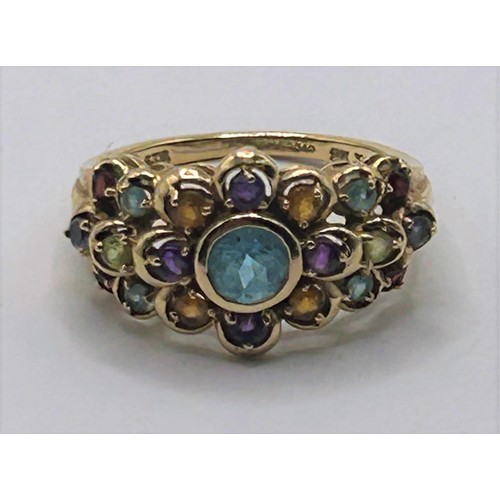 65 - A 9ct and multicoloured stone ring, ring size K1/2