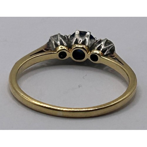 82 - An 18ct gold, sapphire and diamond three stone ring, ring size N