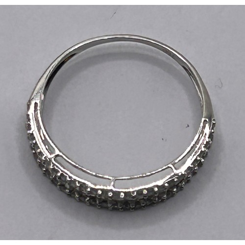 90 - An 18ct white gold and diamond half eternity ring, ring size L