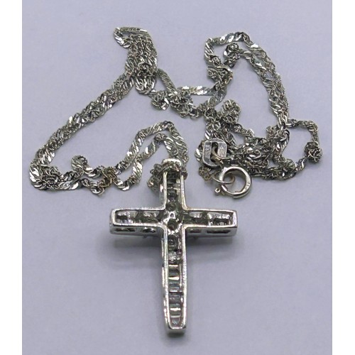 102 - An 18ct white gold and diamond cross, on a chain