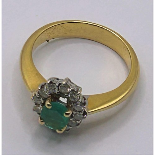 126 - An 18ct gold, emerald and diamond cluster ring, ring size N