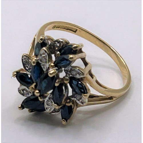 128 - A 9ct gold, diamond and sapphire cluster ring, ring size J