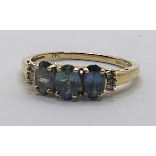 131 - A 14ct gold and blue three stone ring, ring size P1/2