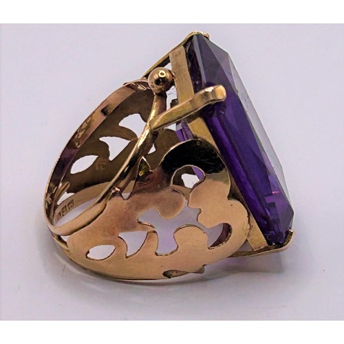 147 - An 18ct gold and purple stone ring, ring size N