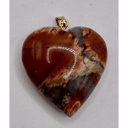 28 - A hardstone pendant, in the form of a heart...