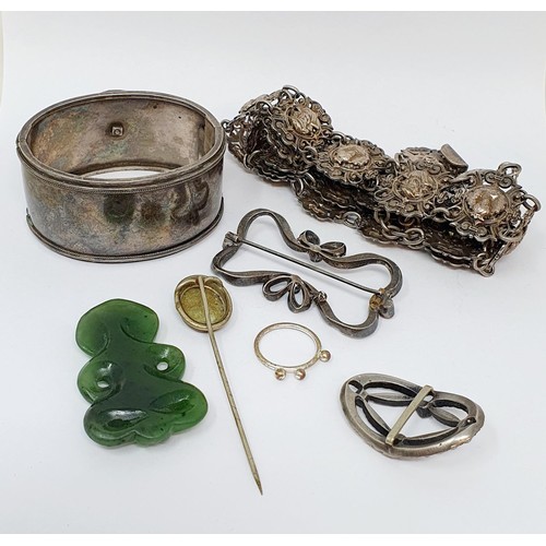 209 - A silver bangle, an Indian silver coloured metal necklace, and other jewellery