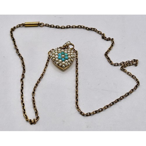 105 - A yellow coloured metal, seed pearl and turquoise heart shaped pendant, on a chain