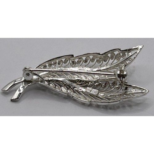 144 - A silver filigree brooch