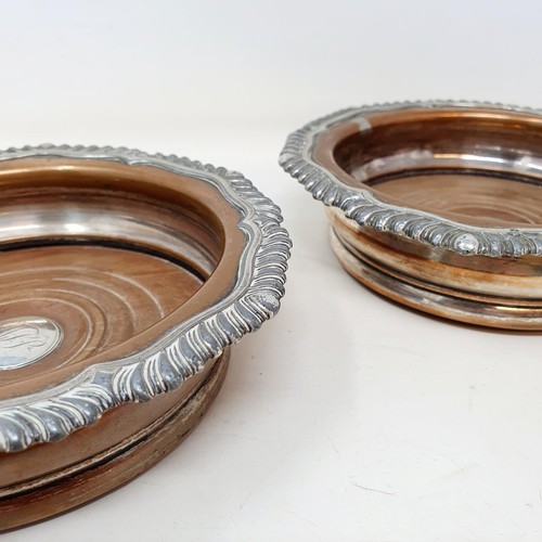 265 - A pair of Old Sheffield plate bottle coasters, 17 cm diameter