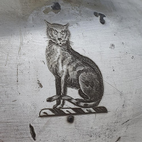 269 - A silver plated meat cover, engraved a cat crest, 60 cm wide